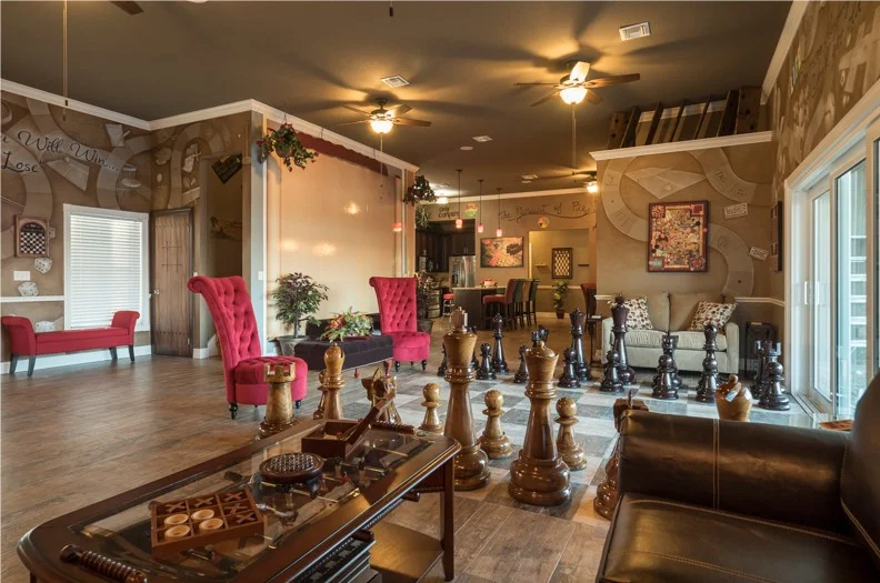 The formal living room of The Great Escape Lakeside - with giant chess